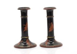 A pair of Grecian-style candlesticks,