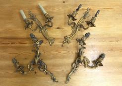 Two pairs of gilt metal Rococco wall lights,