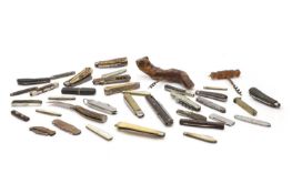 A large collection of penknives and corkscrews,