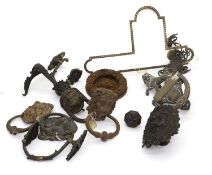 A large group of metal door knockers,