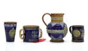 A collection of Royal Doulton Queen Victoria commemorative wares,