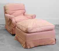 A traditional armchair and matching footstool,