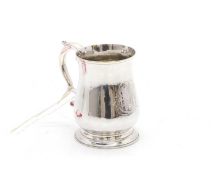 A silver Christening mug,