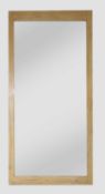 A large rectangular pine-framed mirror,
