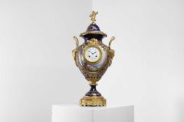 An ormolu-mounted porcelain mantel clock,