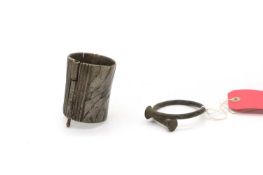 A heavy white metal cuff bracelet,