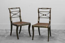 A pair of Regency painted chairs,