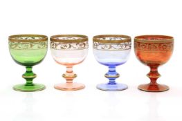 A set of four coloured Murano glass goblets,