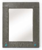 An Arts and Crafts pewter mirror,