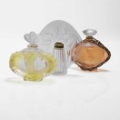 A collection of Lalique glass scent bottles,