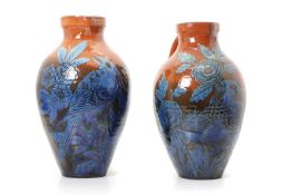 Two similar C H Brannam Pottery jugs,