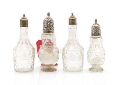 A group of cut-glass bottles and sugar casters,
