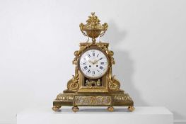 A Louis XV-style ormolu mantel clock,
