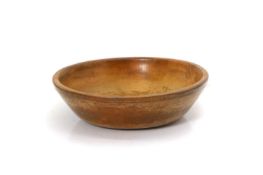 A turned fruitwood milk bowl,