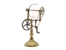 A brass yarn spinning wheel,