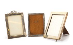 Three silver-mounted photograph frames,