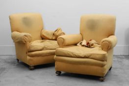 A pair of traditional armchairs,