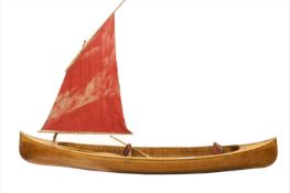 A cedarwood strip sailing canoe,