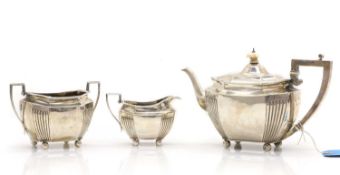 A three-piece silver tea service,