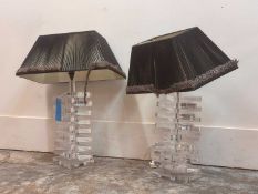 A pair of clear Lucite table lamps,