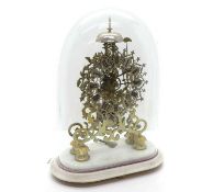 A skeleton clock on a marble base,