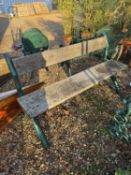 A cast iron and wood bench,