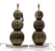 A pair of amethyst glass table lamps,