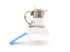 A silver-mounted claret jug,