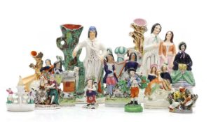 A collection of Staffordshire pottery figures and flatbacks,