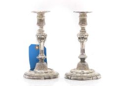 A pair of French cast silver candlesticks,