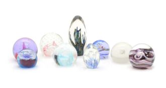 A collection of twelve boxed Caithness glass paperweights