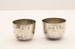Two silver tumbler cups,