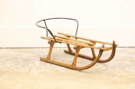 A child's pine toboggan or sledge,
