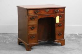 A mahogany kneehole desk,