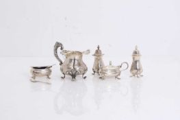 A four-piece silver condiment set,