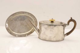 A Georgian style oval teapot and matching stand,