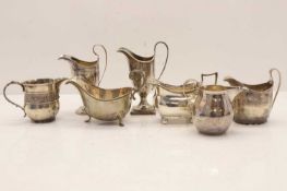 A collection of seven various silver cream, milk and sauceboats,