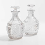 A pair of Regency Anglo-Irish cut glass decanters,