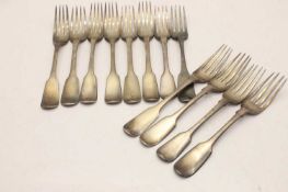 A composite set of eight Irish silver fiddle pattern dessert forks,