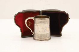 A cased silver mug,