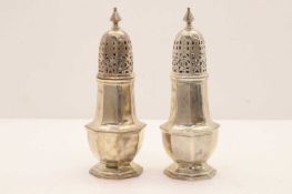 A pair of silver sugar castors,