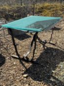 A glass top garden table,