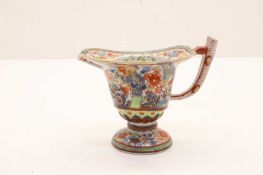 A Chinese export porcelain clobbered milk jug,