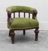 A Jacobean style carved oak captain's chair,
