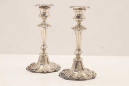 A pair of silver candlesticks,