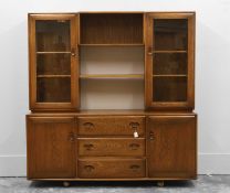 An Ercol dark elm wall cabinet,