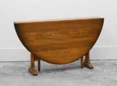 An Ercol dining table,