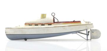 An unusual early tin live steam racing boat,