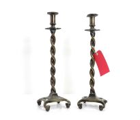A pair of brass candlesticks,