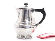 A silver planished coffee pot,